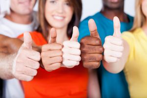 group of multiracial friends thumbs up